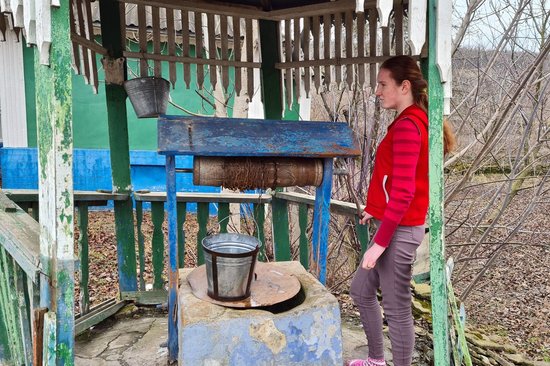 Woman next to a well